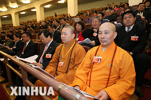 3月13日，十届全国人大五次会议在北京人民大会堂举行第四次全体会议。这是全国政协委员列席大会。